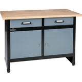 Armadio da officina Flott in lamiera d’acciaio con 2 cassetti superiori e 2 ante inferiori, posizionato accanto a una macchina utensile, ideale per riporre utensili e ricambi.